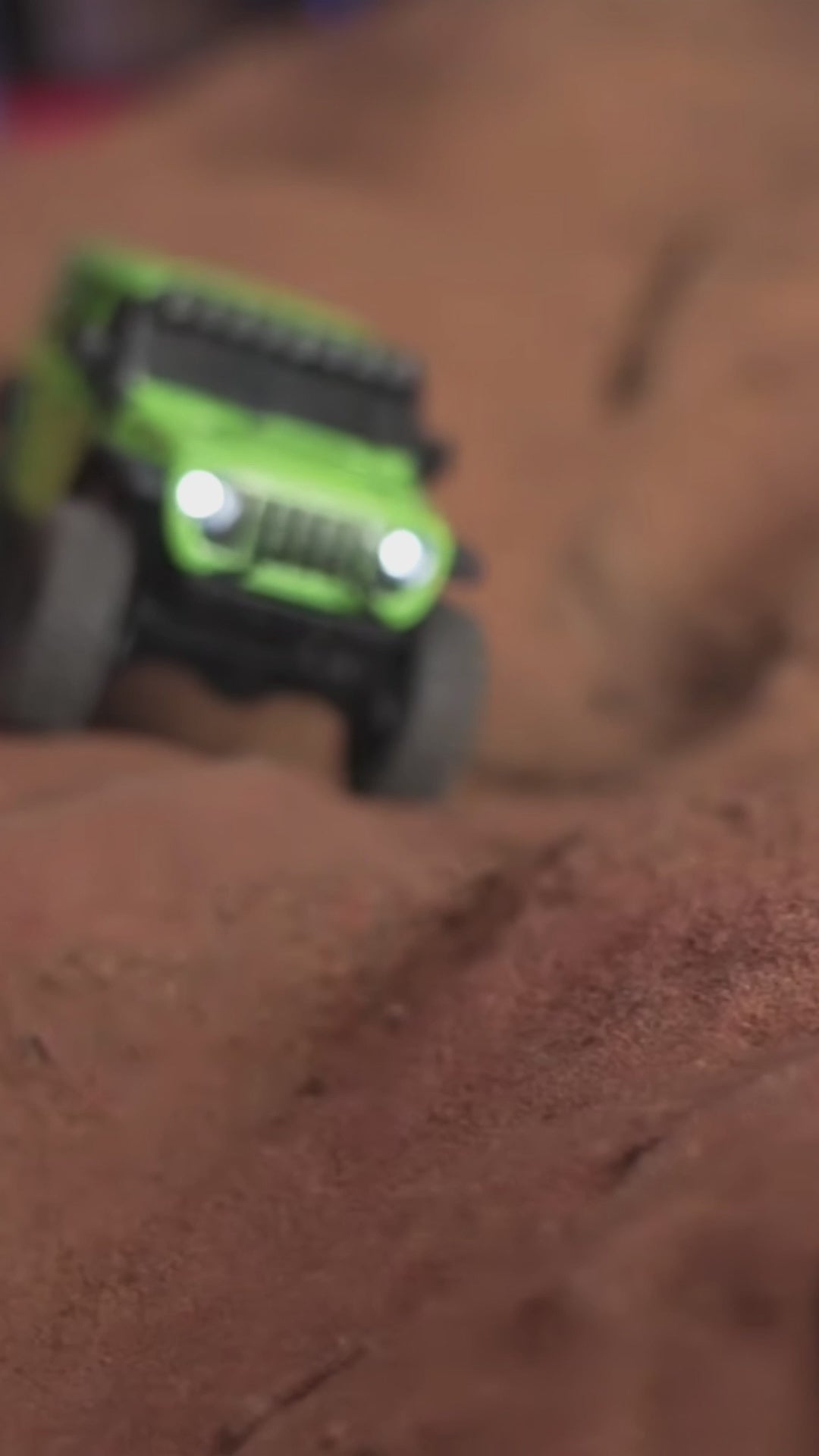 Load video: 1/3oth Scale RC 4 x 4 Trucks performing technical crawling on a mobile mountain course.